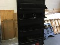Double sided black 3' x 7' Slat wall floor stand with custom plastic shelves